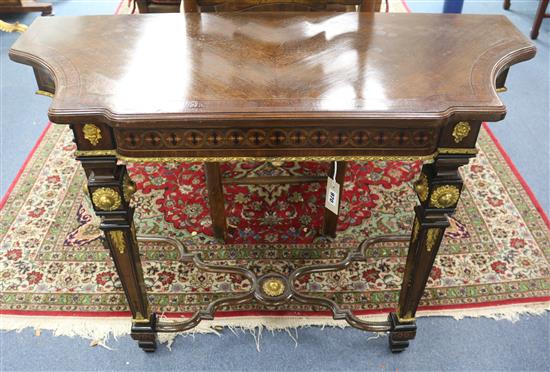 A Napoleon III walnut and bronze mounted console table W.112cm